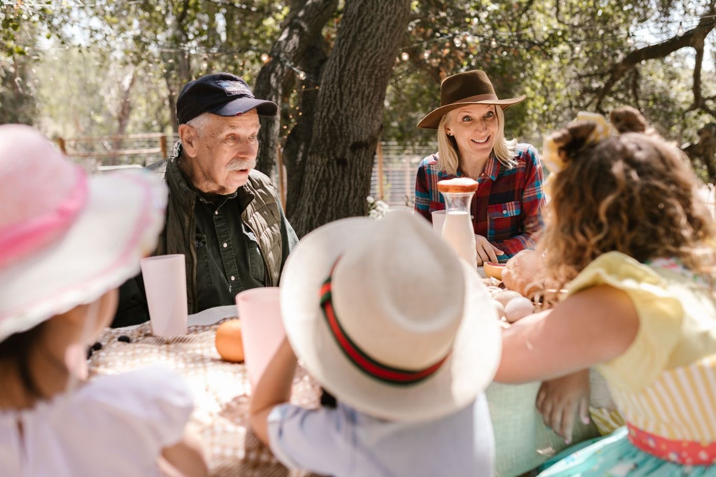 Three generations at a picnic table